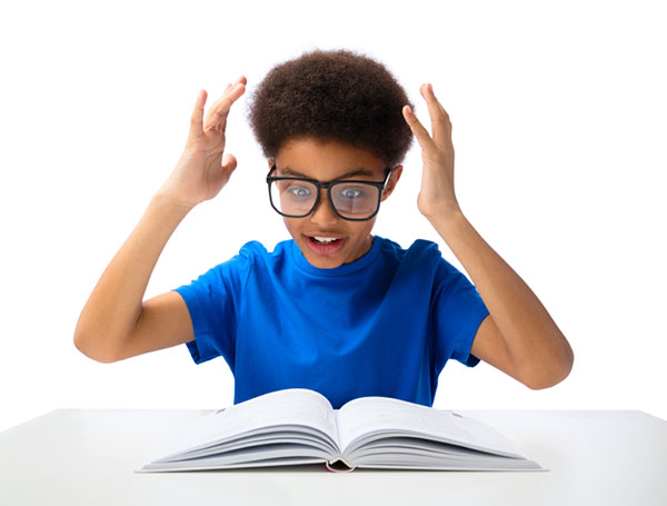 boy excitedly reading a book