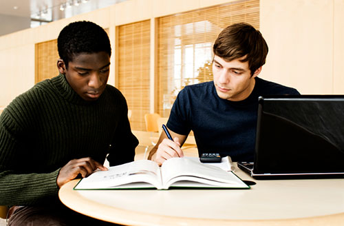 two students studying a text