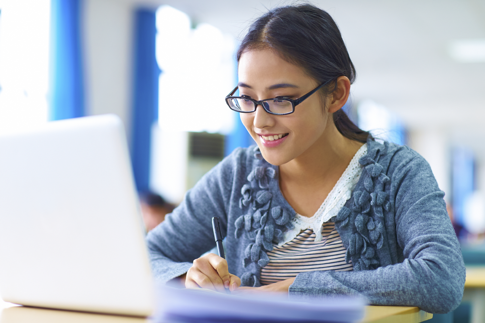 female student working at computer